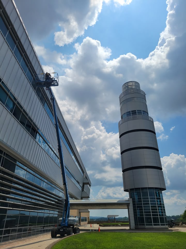 Professional window cleaner at work